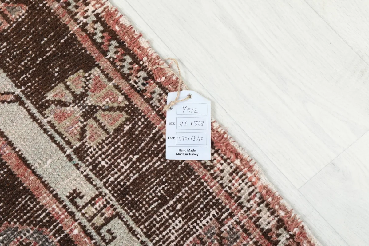 Detail of the rug's label with size information, resting on the pile