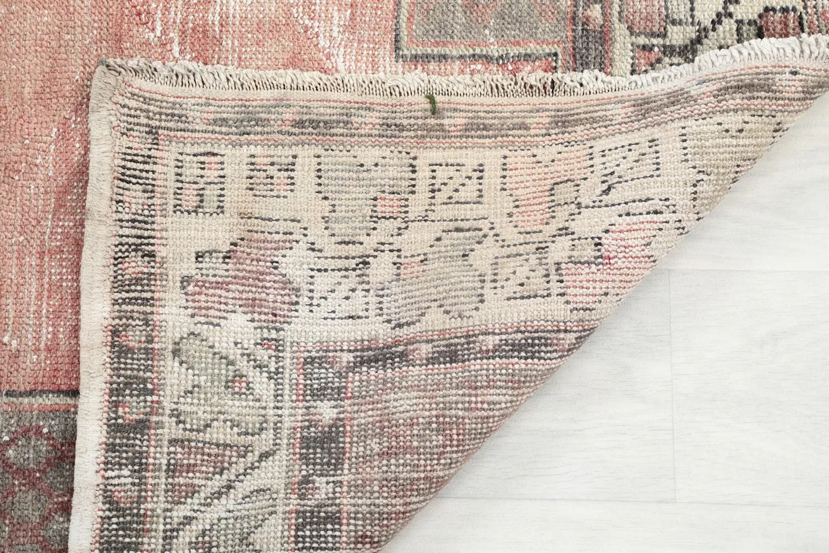 Underside of the rug revealing the hand-knotted cotton foundation