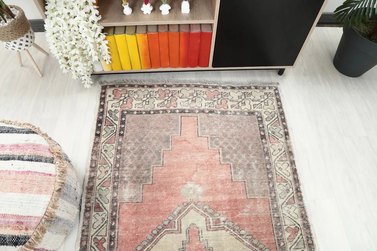 Overhead view of the rug from one end in a room setting
