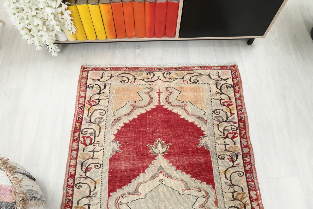 Top-down angle view of the Red Medallion Anatolian Area Rug, focusing on the upper part of the rug.