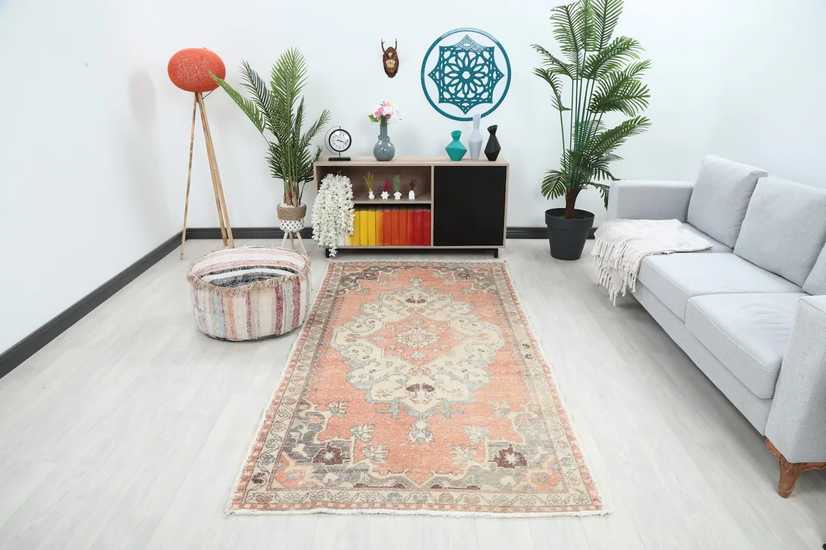 Vintage Anatolian rug in a modern living room setting with a gray couch