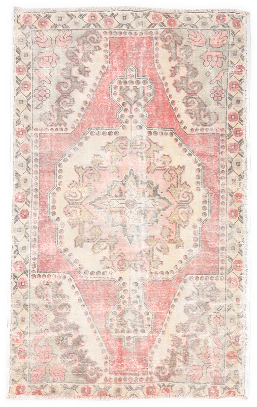 Full overhead view of the hand-knotted rose and beige Anatolian vintage rug on a white background.