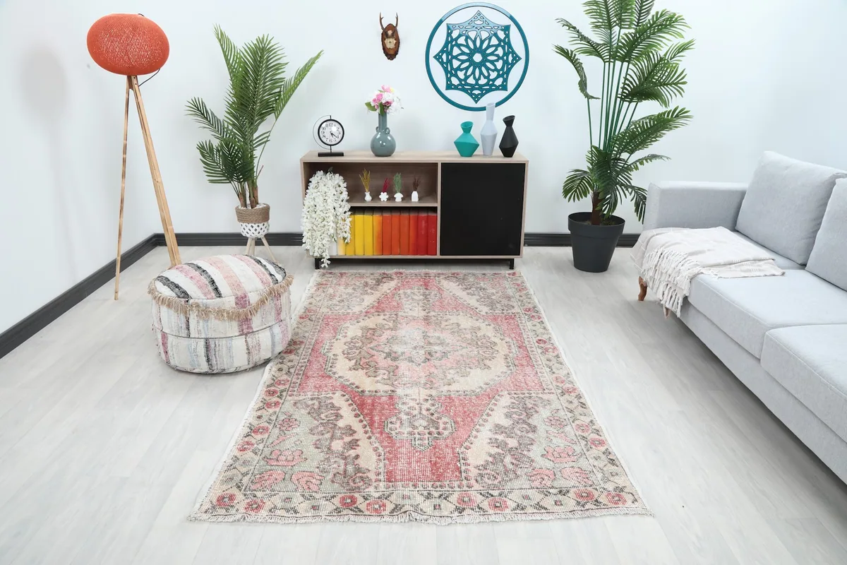 Full room view with the rug centered, demonstrating its scale and aesthetic in a decorated setting.