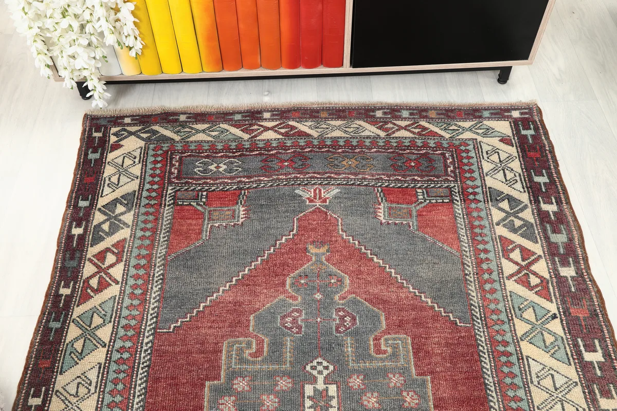 Top portion of the Red Gray Tribal Medallion Rug, showing the upper part of the medallion and border