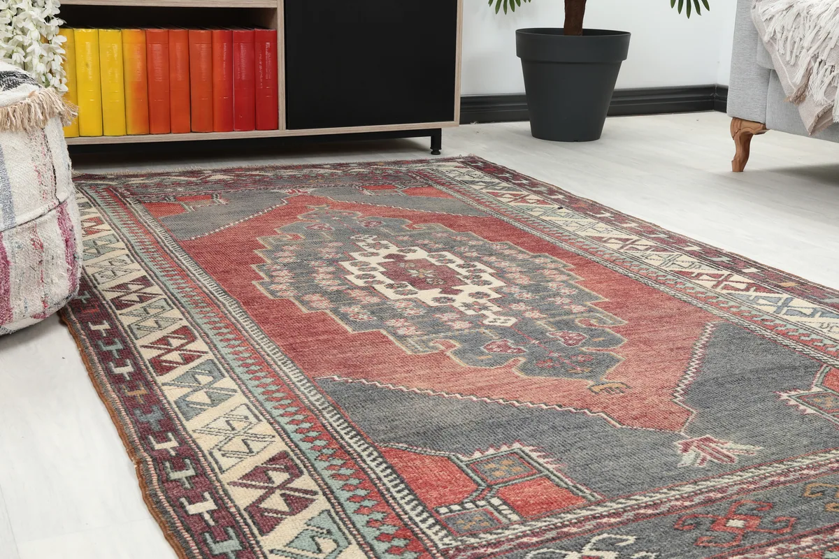 Angle view of the Red Gray Tribal Medallion Rug with its rich red and gray tones
