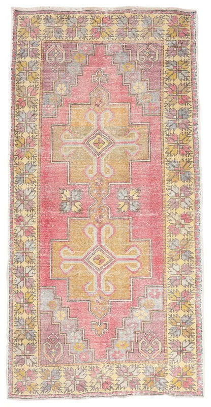 Full overhead view of the vintage rose and gold Anatolian area rug