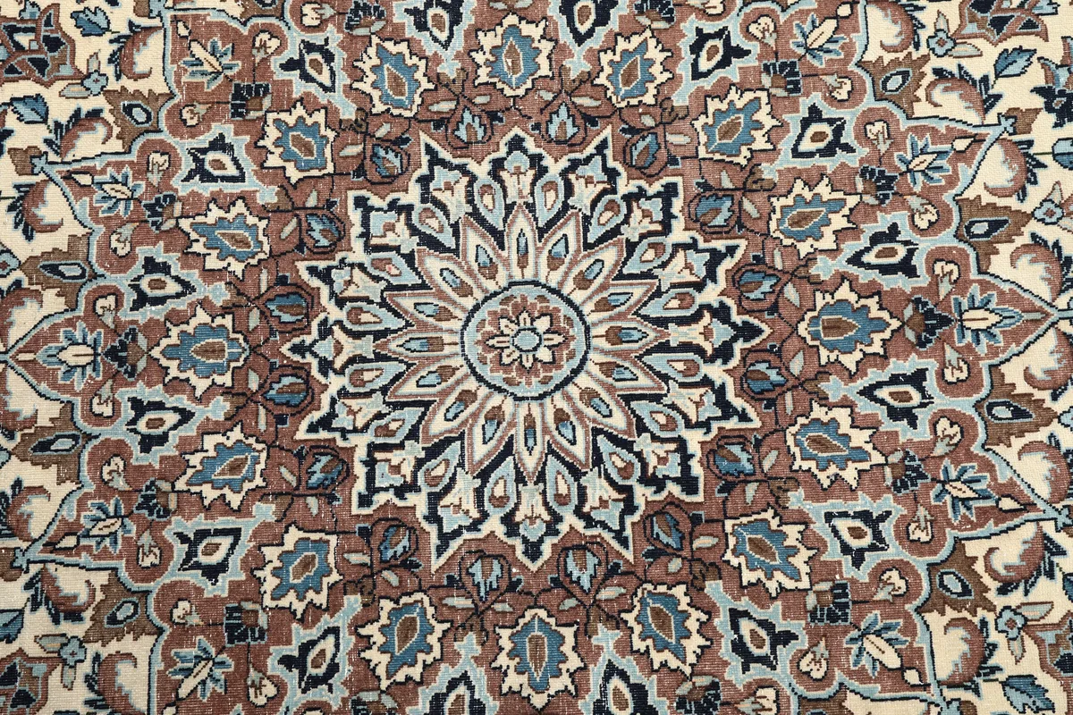 Detailed shot of the central medallion of the Ivory Floral Medallion Anatolian Rug