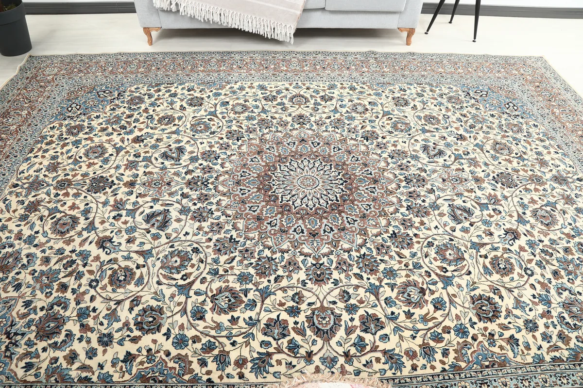 Wide view of the Ivory Floral Medallion Anatolian Rug laid out in a room
