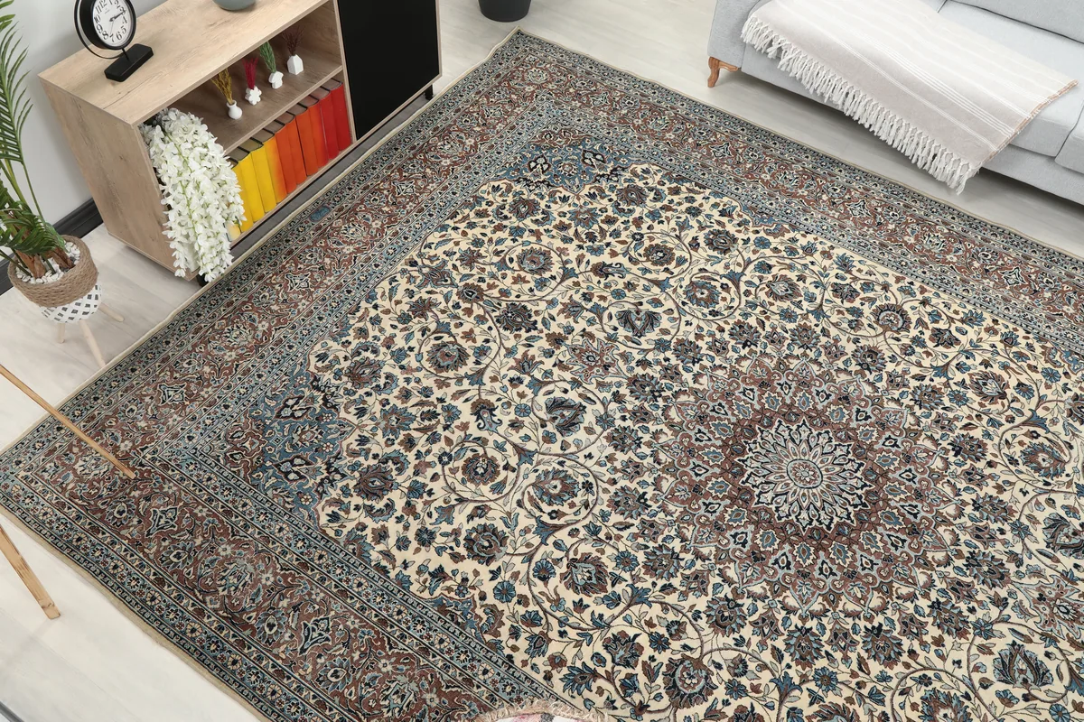 Angled room shot of the Ivory Floral Medallion Anatolian Rug, highlighting its size and design impact