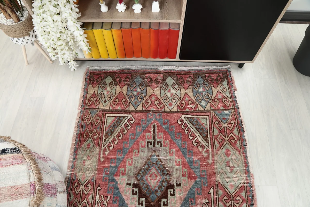 Overhead shot of one end of the vintage runner, highlighting its rich pattern