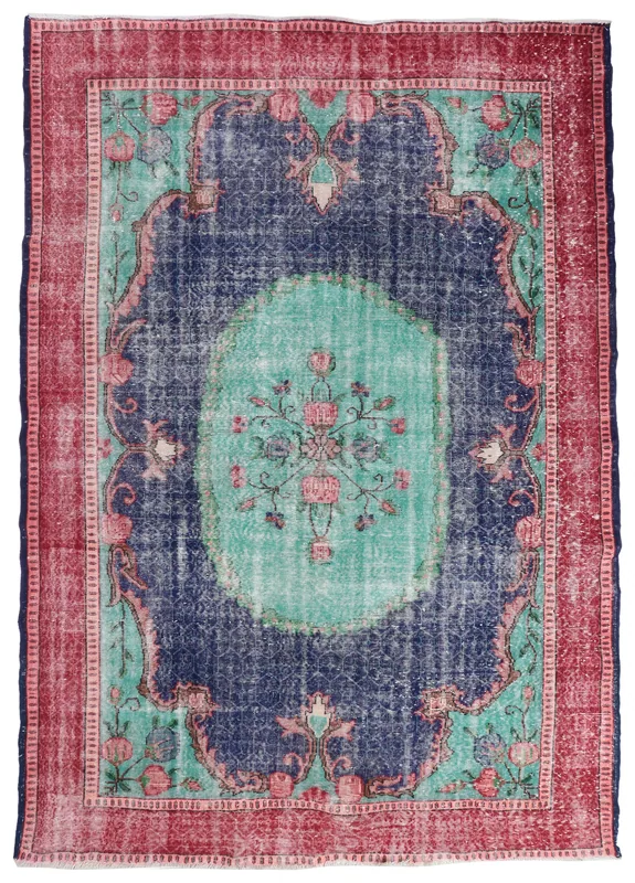 Full overhead view of the navy, red, and green vintage Anatolian area rug