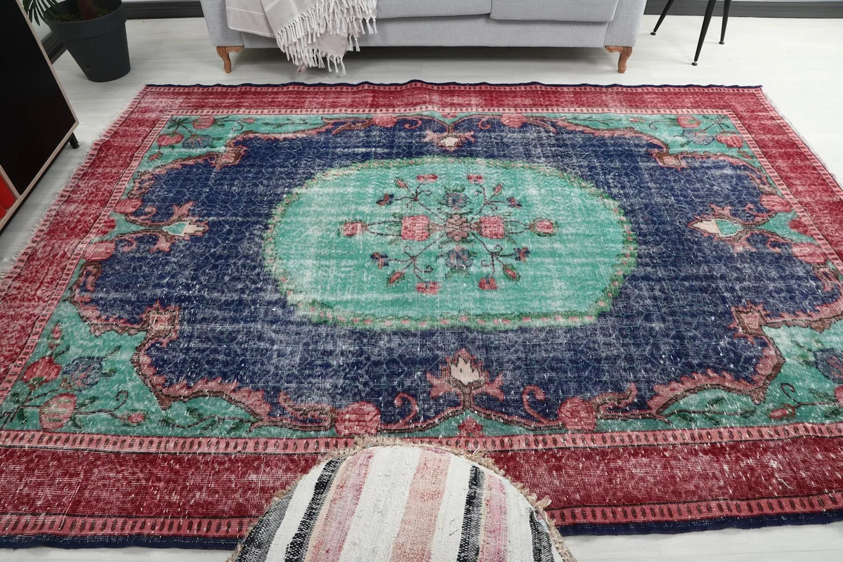 Full view of the rug placed in a living area, emphasizing its color and pattern