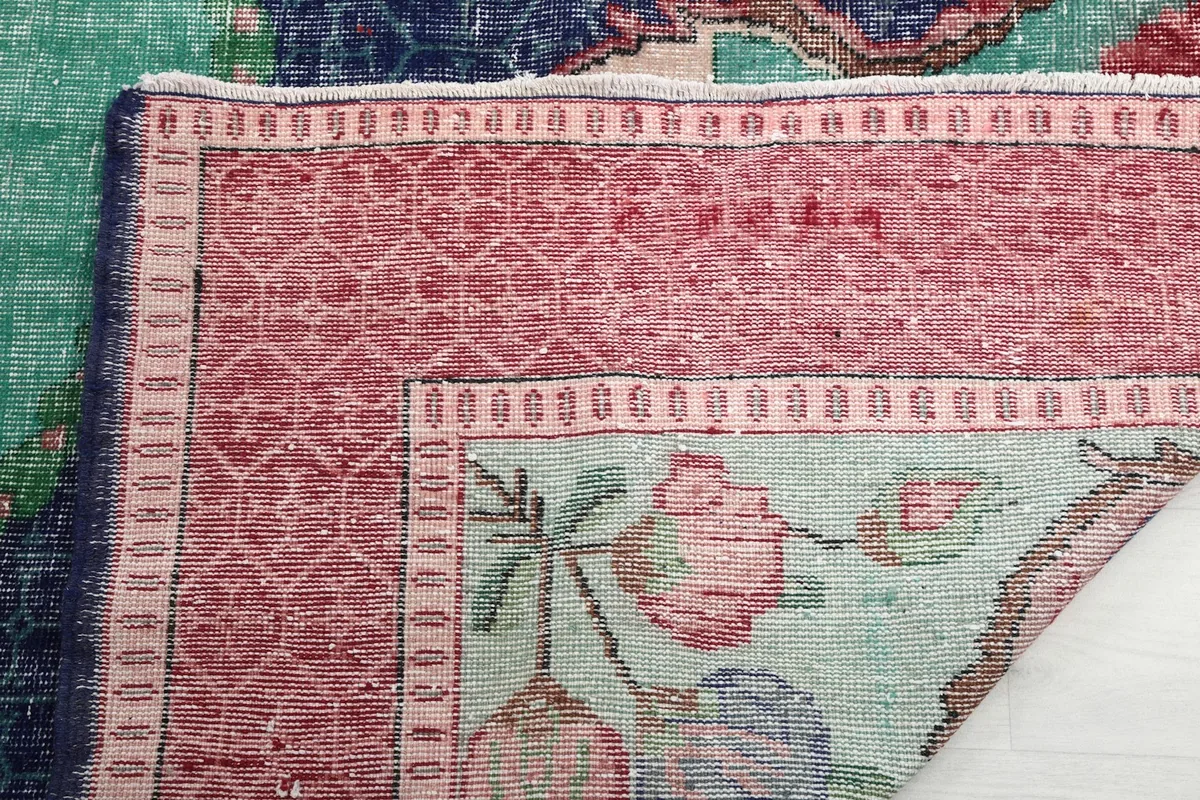 Detailed view of the rug's underside, revealing the hand-knotted construction