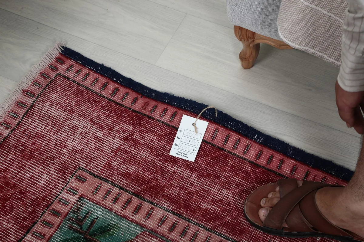 Close-up of the rug's edge and tag, showing the quality and finish
