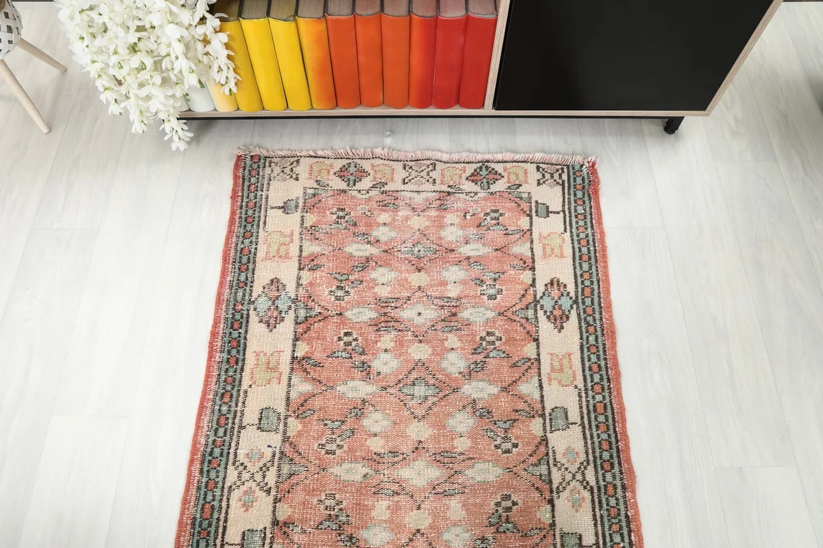 Overhead shot of one end of the rose runner rug, emphasizing its geometric design.