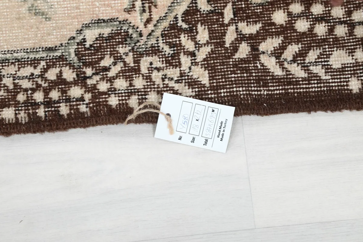 Tag indicating the rug's origin from Turkey on the edge of the brown border