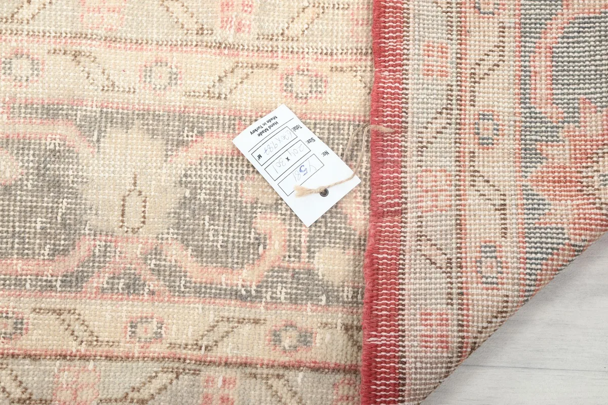 Close-up of the rug's backside with a product tag, showing the weave detail