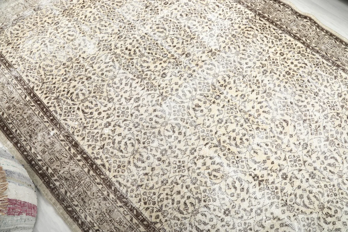 Overhead angled view of the rug's surface, revealing the overall pattern and color variations.