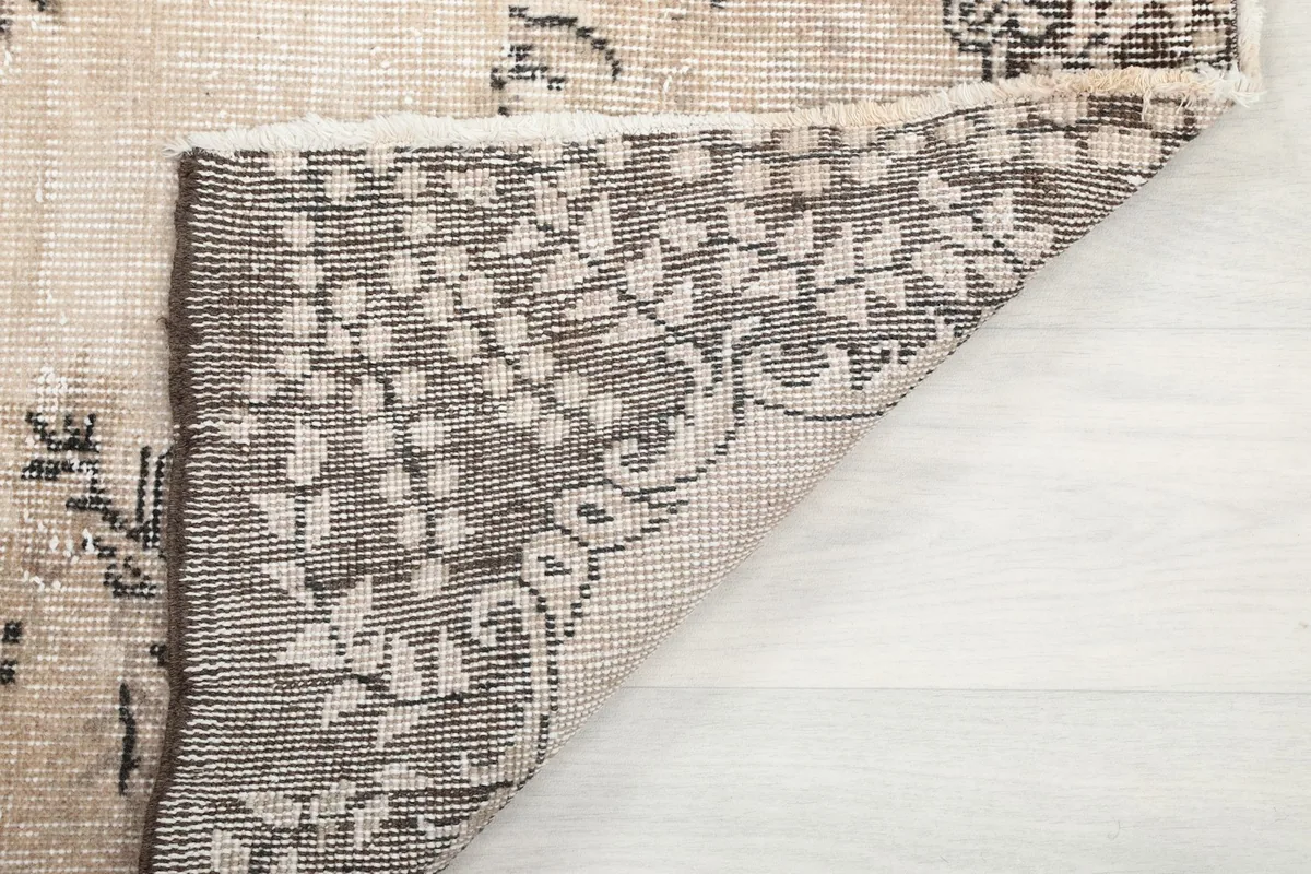 Close-up of the back of the rug, showing the detailed weave and craftsmanship