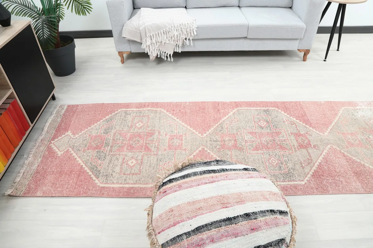 Runner rug extending through a living space, viewed from above
