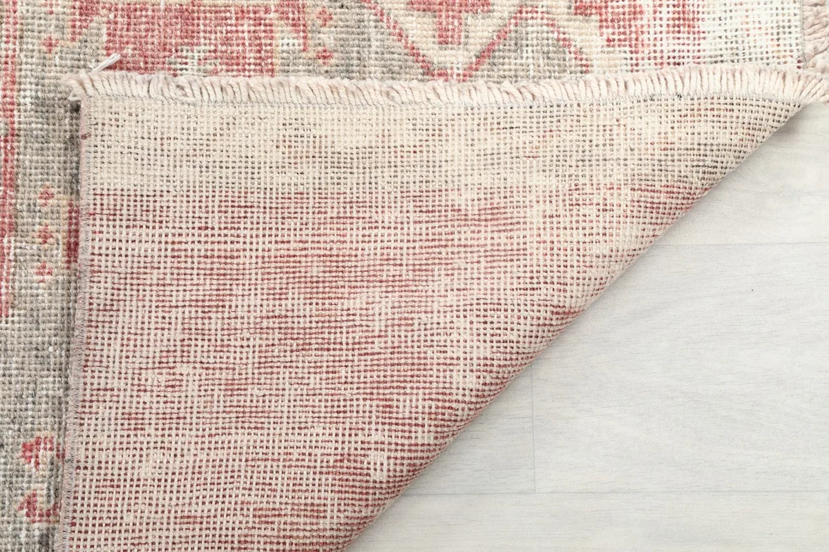 Underside of the runner, showing the hand-knotted cotton foundation