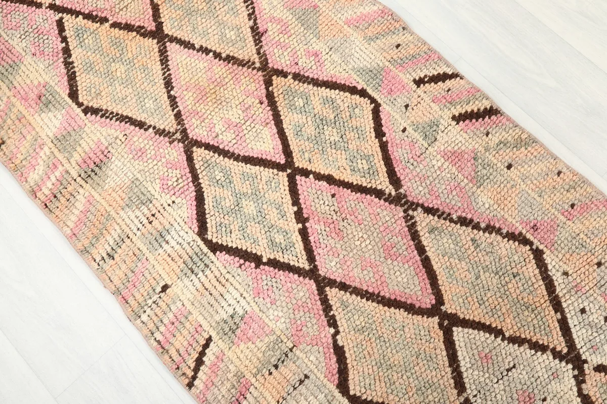 Angled view showing the texture and color variations within the runner's pattern