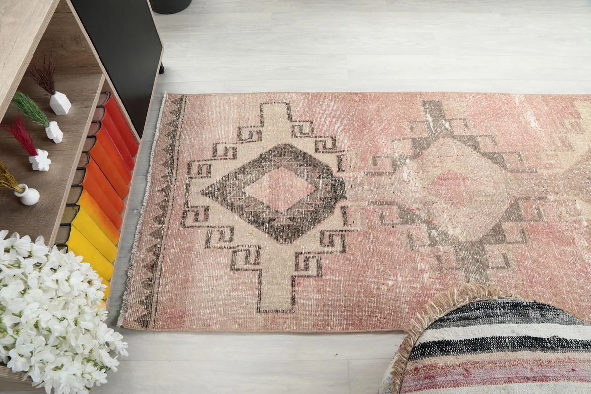 Angle view highlighting the faded rose field and intricate geometric patterns