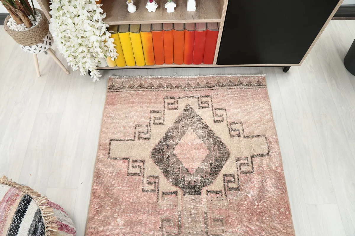 Overhead view of a section of the rose runner rug showing its geometric design