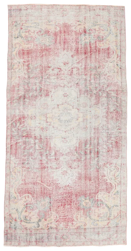 Full overhead view of the 5'3" x 10'4" faded rose vintage Anatolian area rug on a white background.