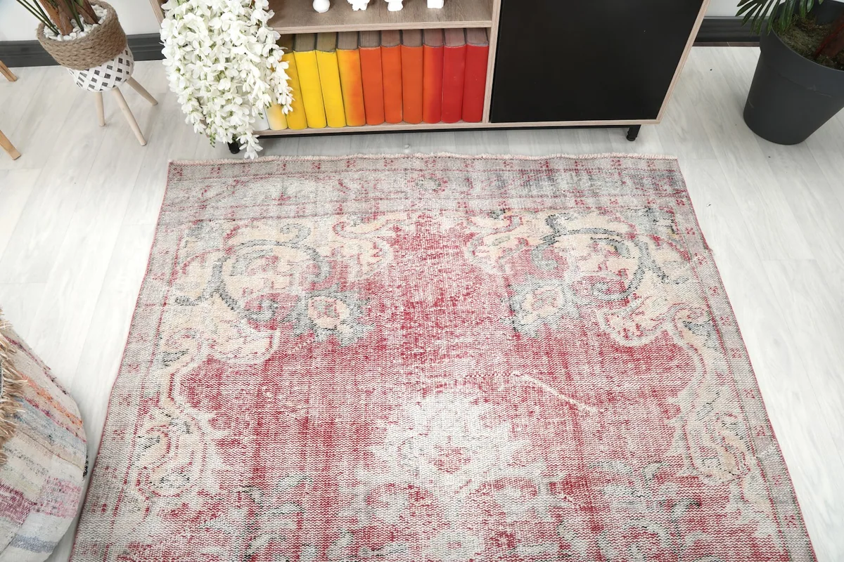 Overhead view of the rose vintage rug in a living room, showcasing its integration with decor.