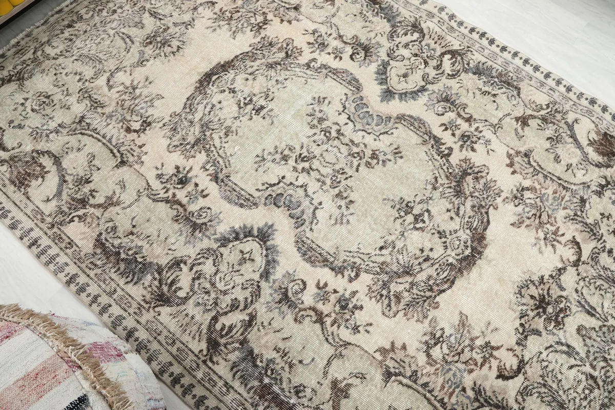 Overhead angle of the rug highlighting the central medallion and surrounding ornate patterns