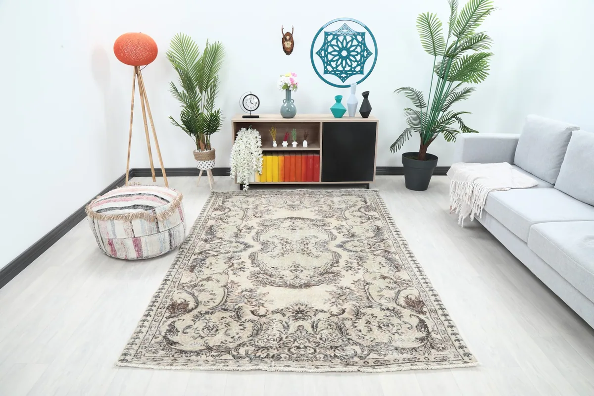 Ivory gray vintage rug displayed in a modern living room setting