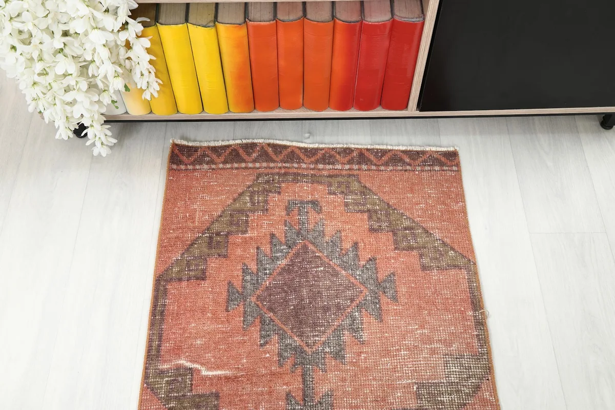 Overhead angled view of one end of the runner, emphasizing the intricate tribal patterns