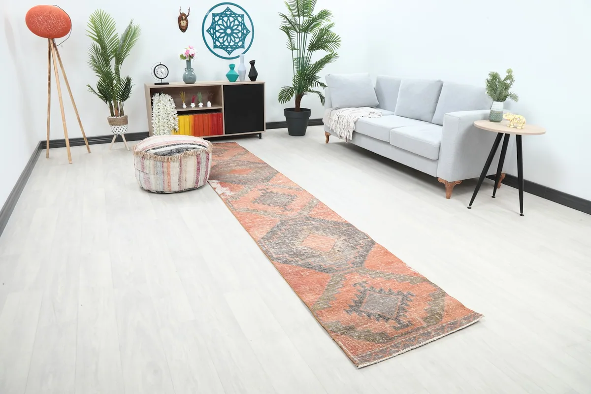 Angled view of the Anatolian runner showing its length and geometric pattern in a home setting