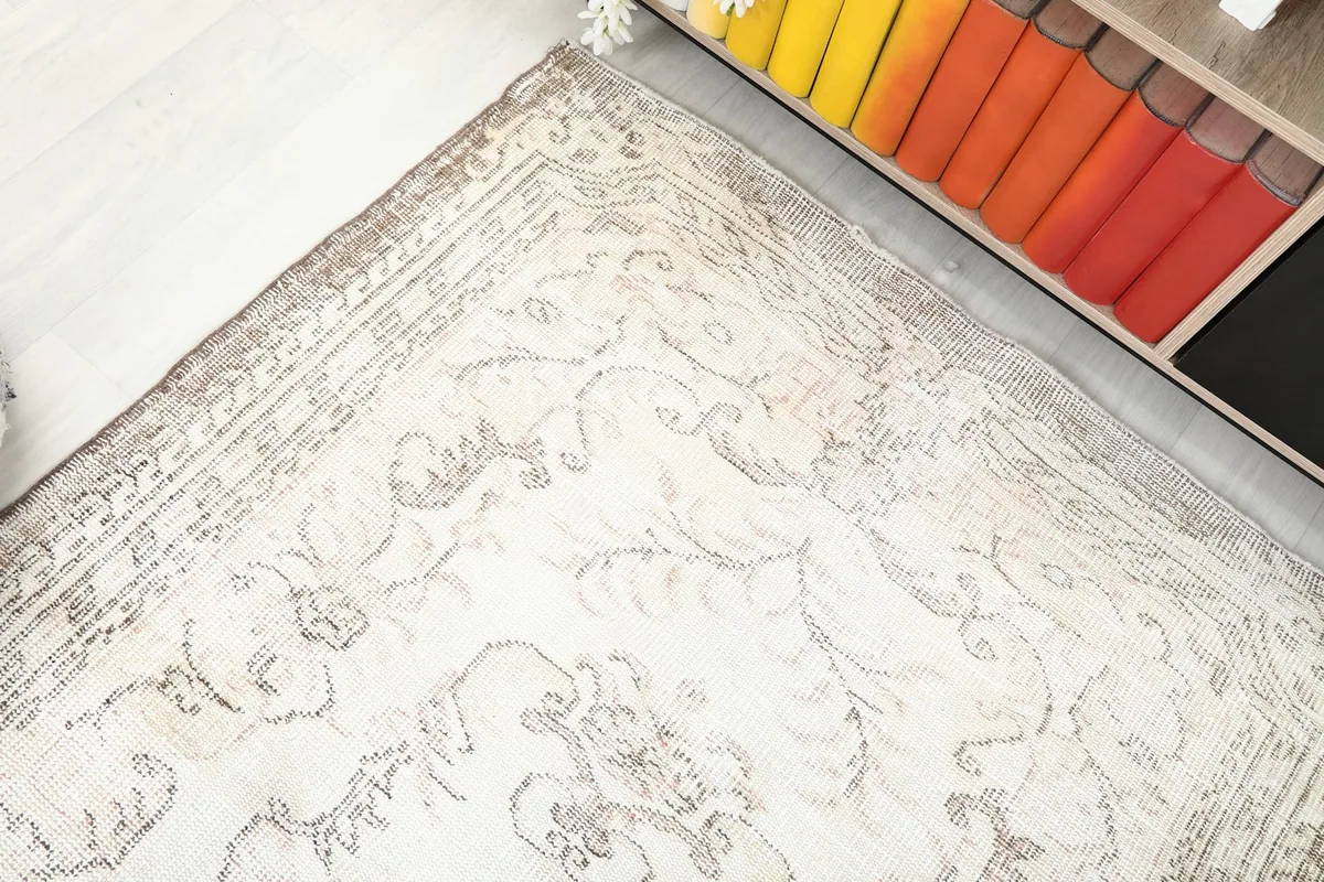 Overhead angled shot of the rug's border and field design, showing its full length
