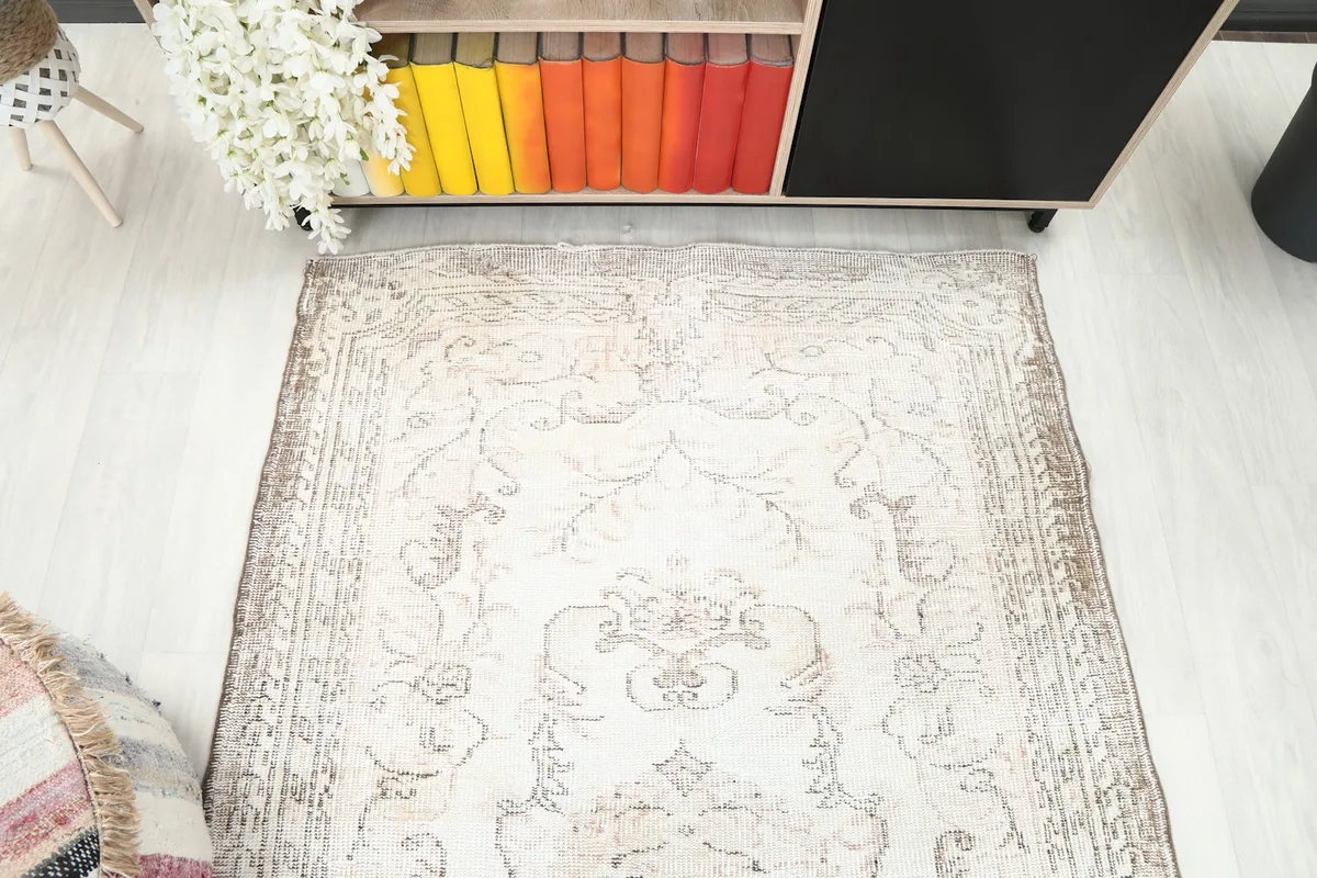 Overhead view of the rug's top half, focusing on the medallion and floral elements