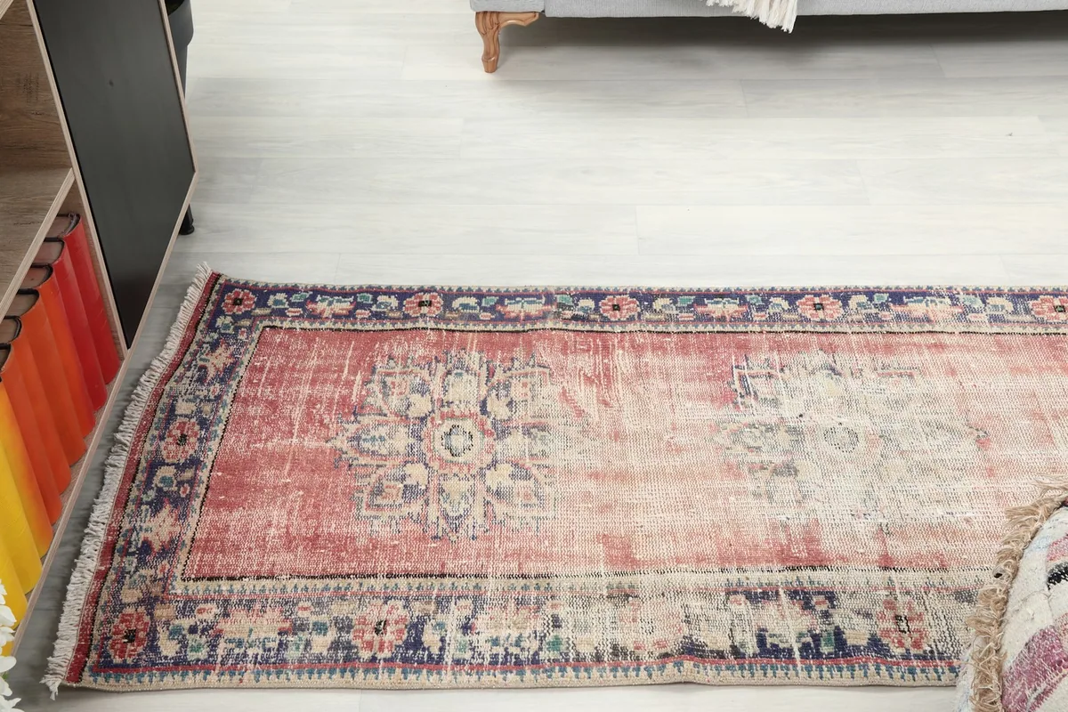 Panoramic view of the runner rug laid out in a room, showing its length and design.
