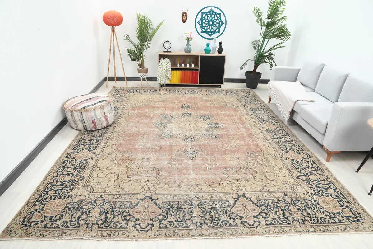 Faded Rose Navy Medallion Floral Rug displayed in a living room setting, showing its size and color palette.