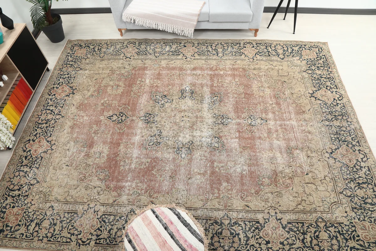 Faded Rose Navy Medallion Floral Rug in a room setting, providing a broader perspective of the rug's placement.