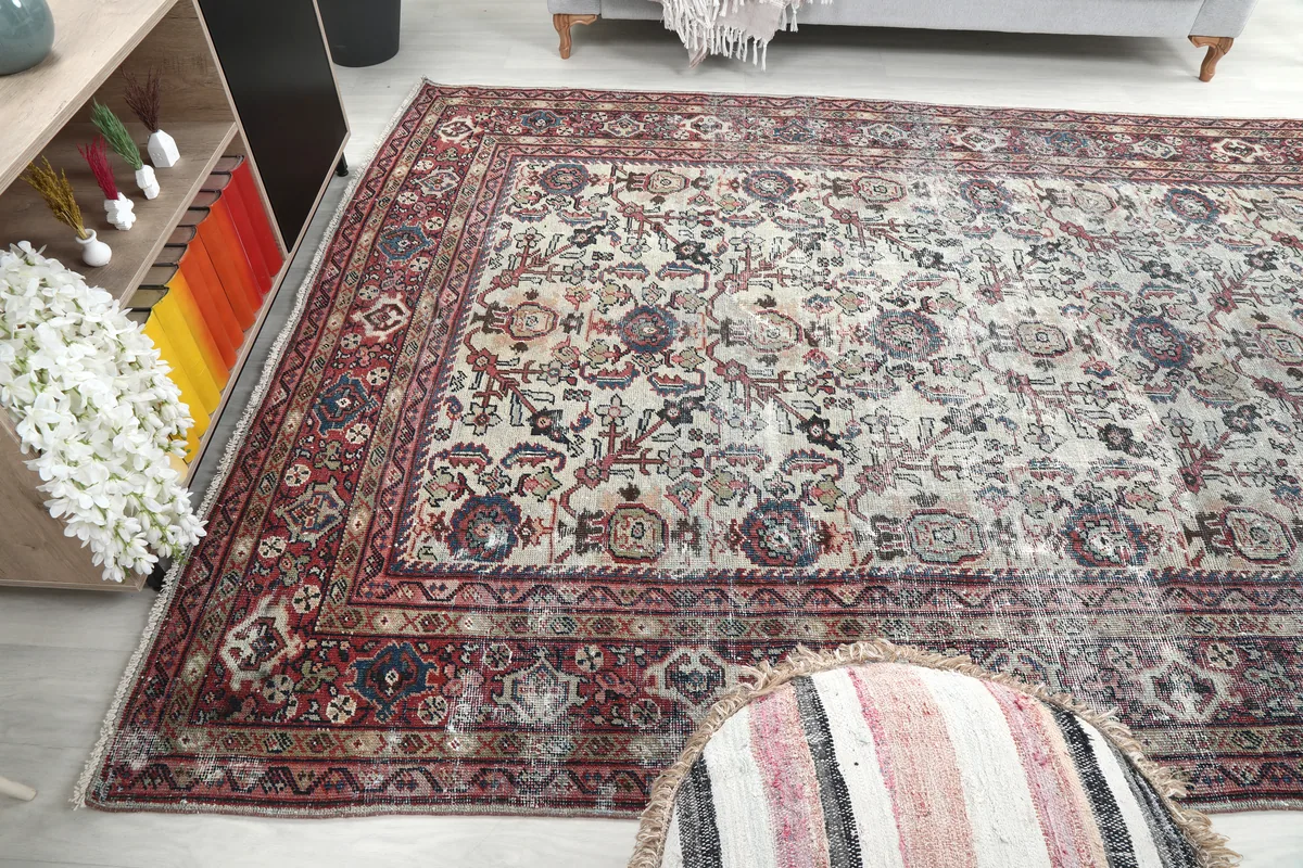 Cream Rose Floral Anatolian Rug in a room, capturing its presence from a wider angle