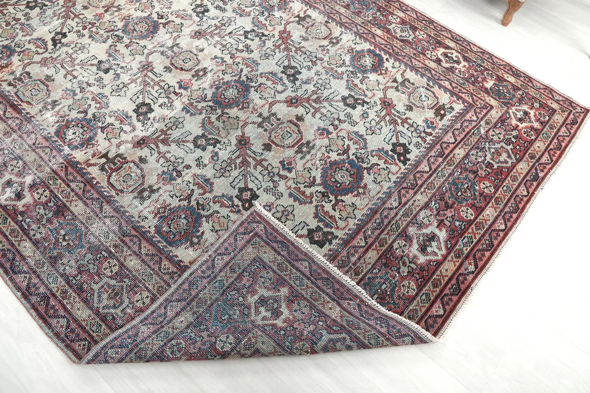 Cream Rose Floral Anatolian Rug folded back to show the reverse side and knotting