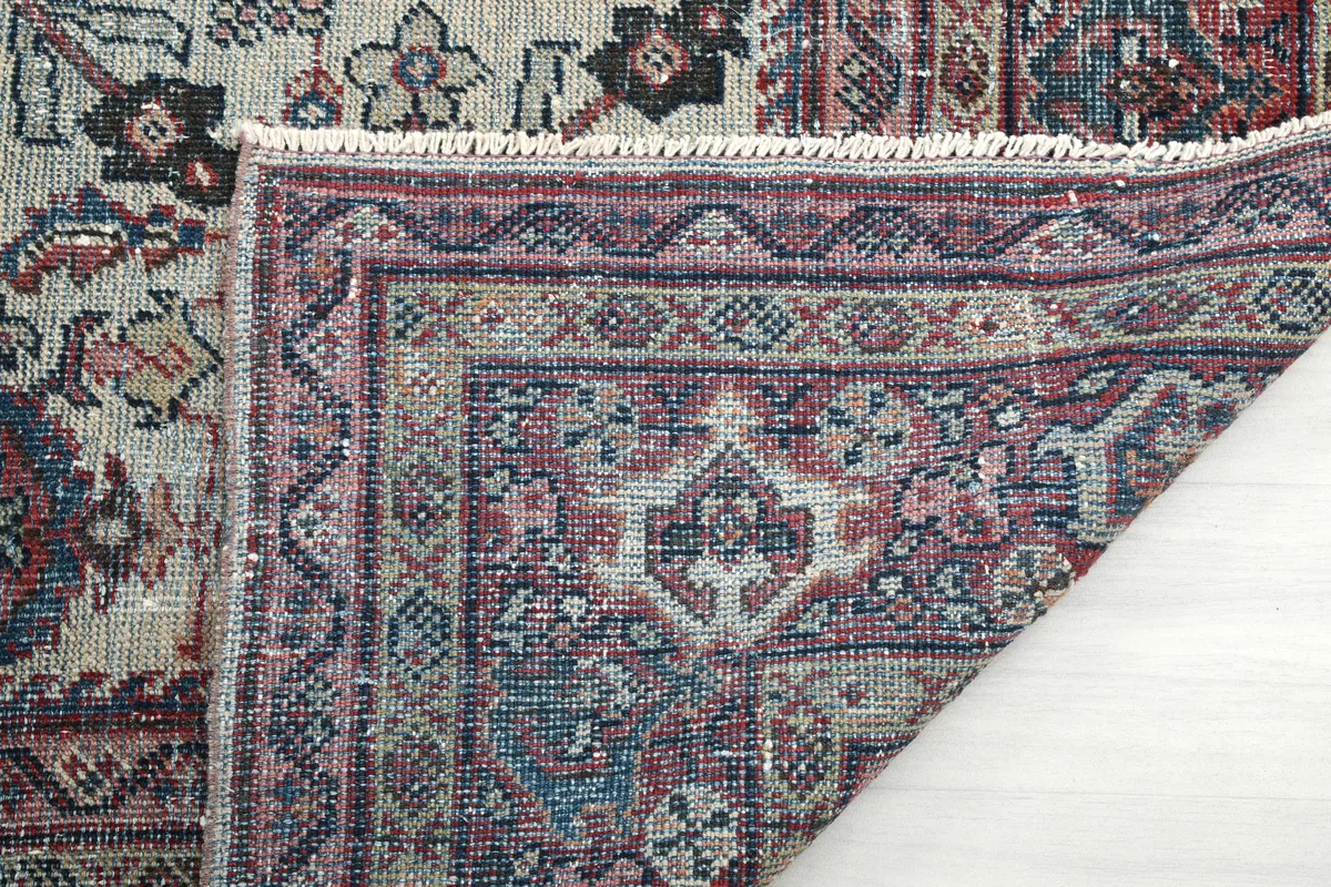 Detail of the Cream Rose Floral Anatolian Rug's back, revealing the hand-knotted cotton foundation