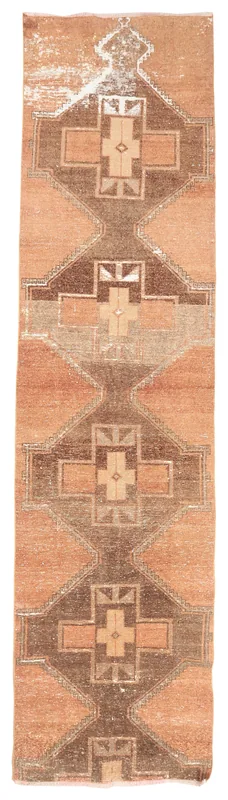 Full overhead view of the 2'11" x 11'9" rust and brown geometric vintage Anatolian runner on a white background.