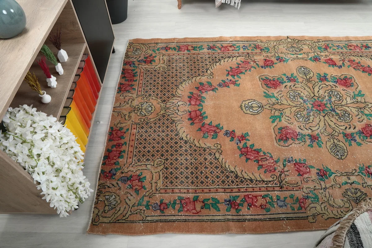 Angled view of the rug from the side, revealing the full pattern and texture on the floor.