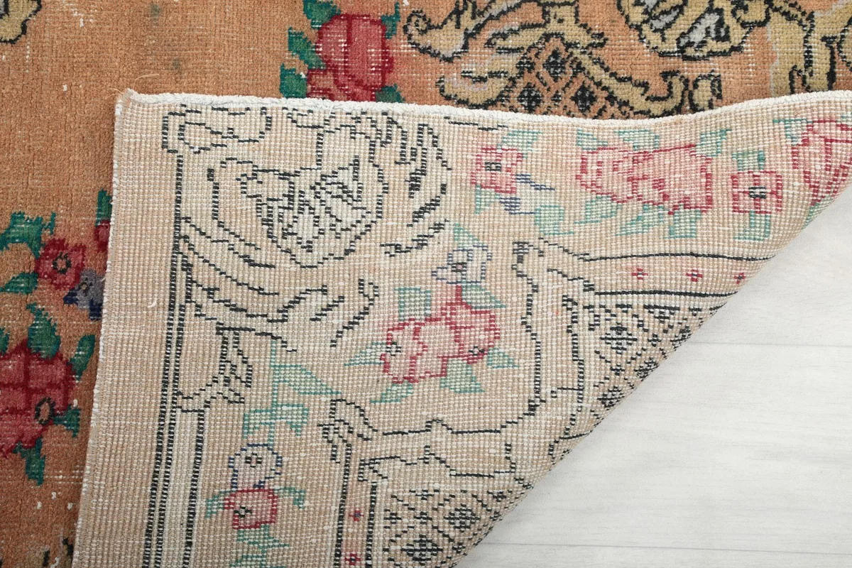 Close-up of the rug's reverse side, illustrating the intricate hand-knotting and material.