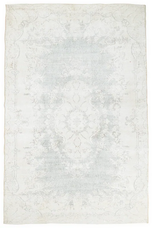 Full overhead view of the cream and faded blue vintage Anatolian area rug