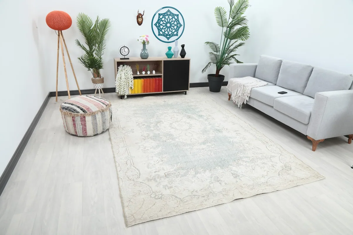 Cream and blue area rug styled in a modern living space with colorful accents