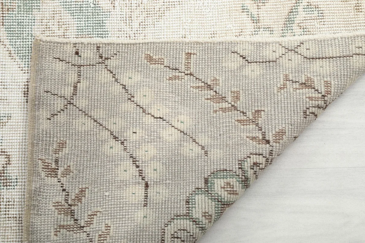 Underside of the hand-knotted wool rug, revealing the intricate knotting and foundation