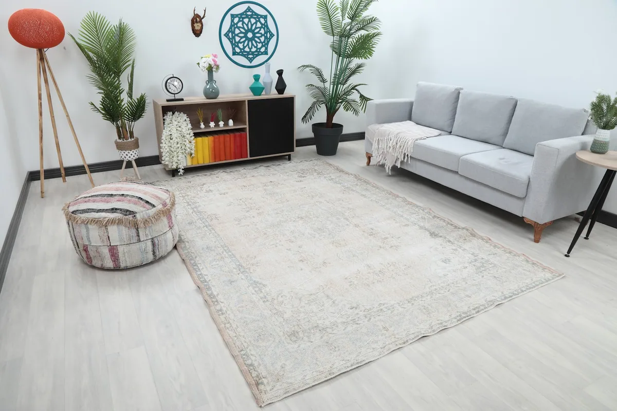 Overhead view of the beige vintage rug showcasing its placement in a modern living space.