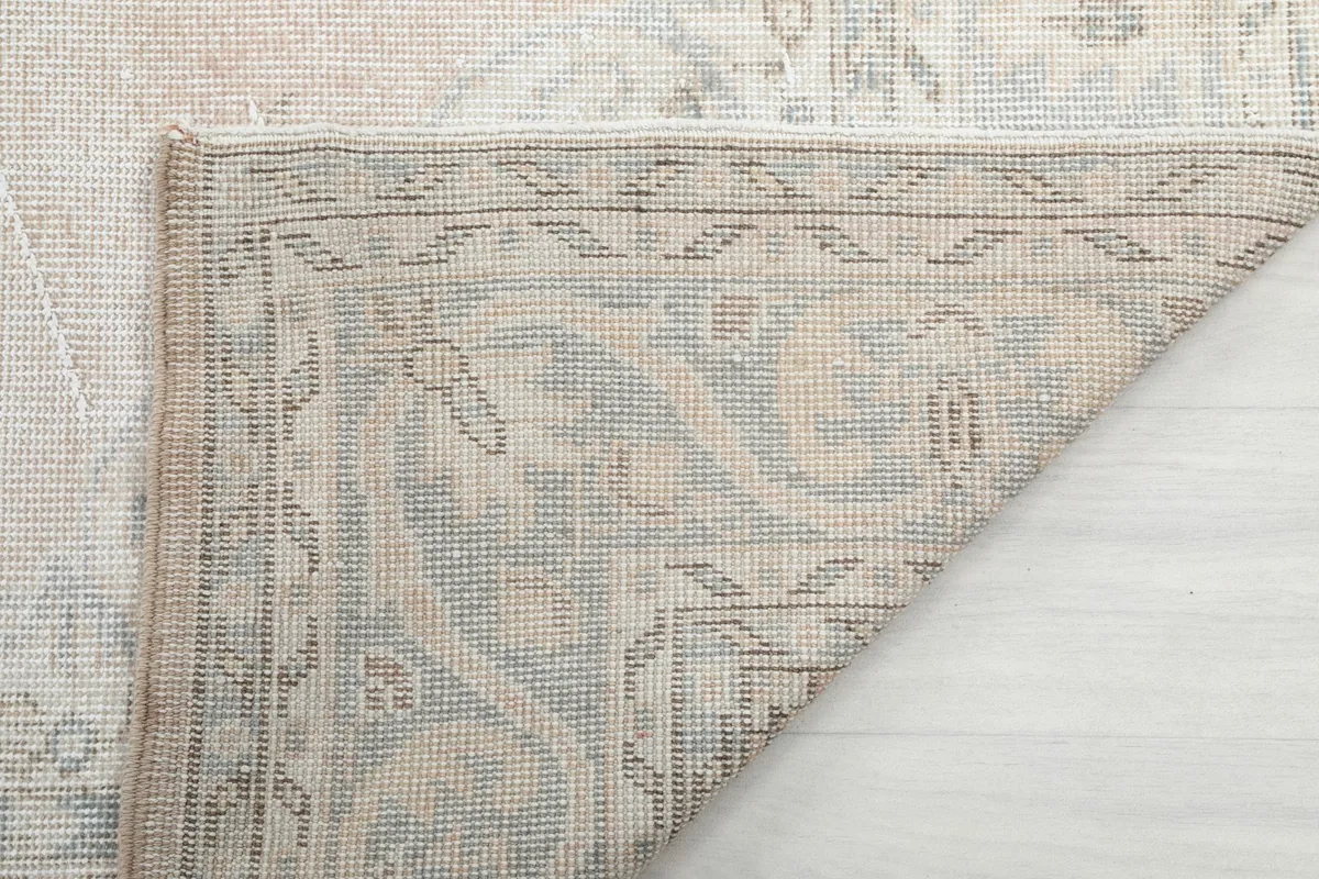 Close-up of the back of the rug, showing the tight hand-knotting and foundation weave.